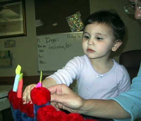 Josie with menorah