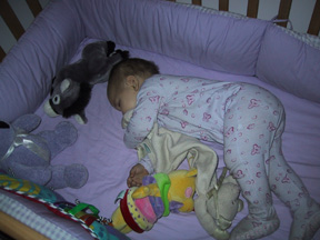 Josie asleep in crib